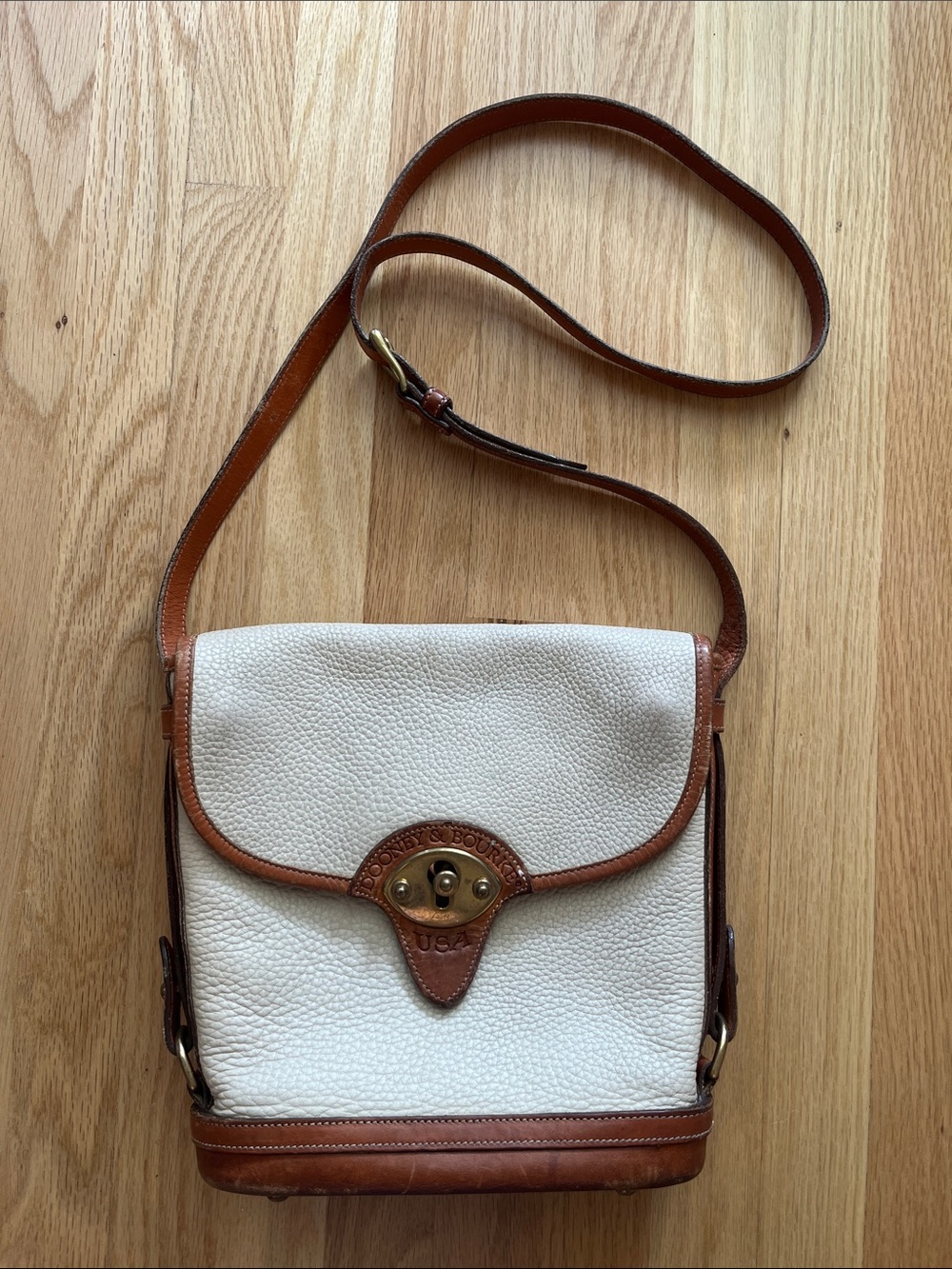 Dooney & Bourke White Pebbled Leather Crossbody Bag with Brown Trim